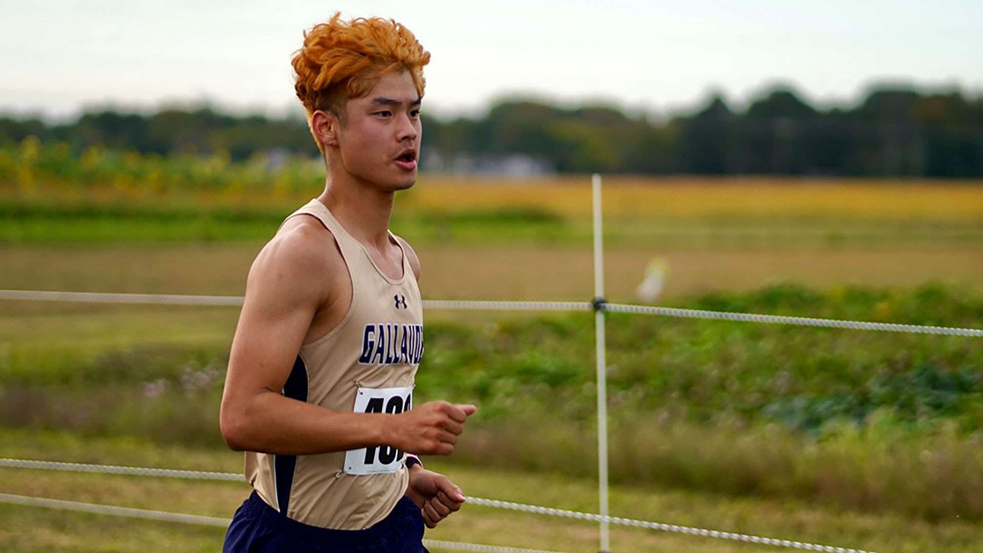 Gallaudet men's cross country runner Trent Gobble runs in the afternoon on a cool cloudy day in Virginia.