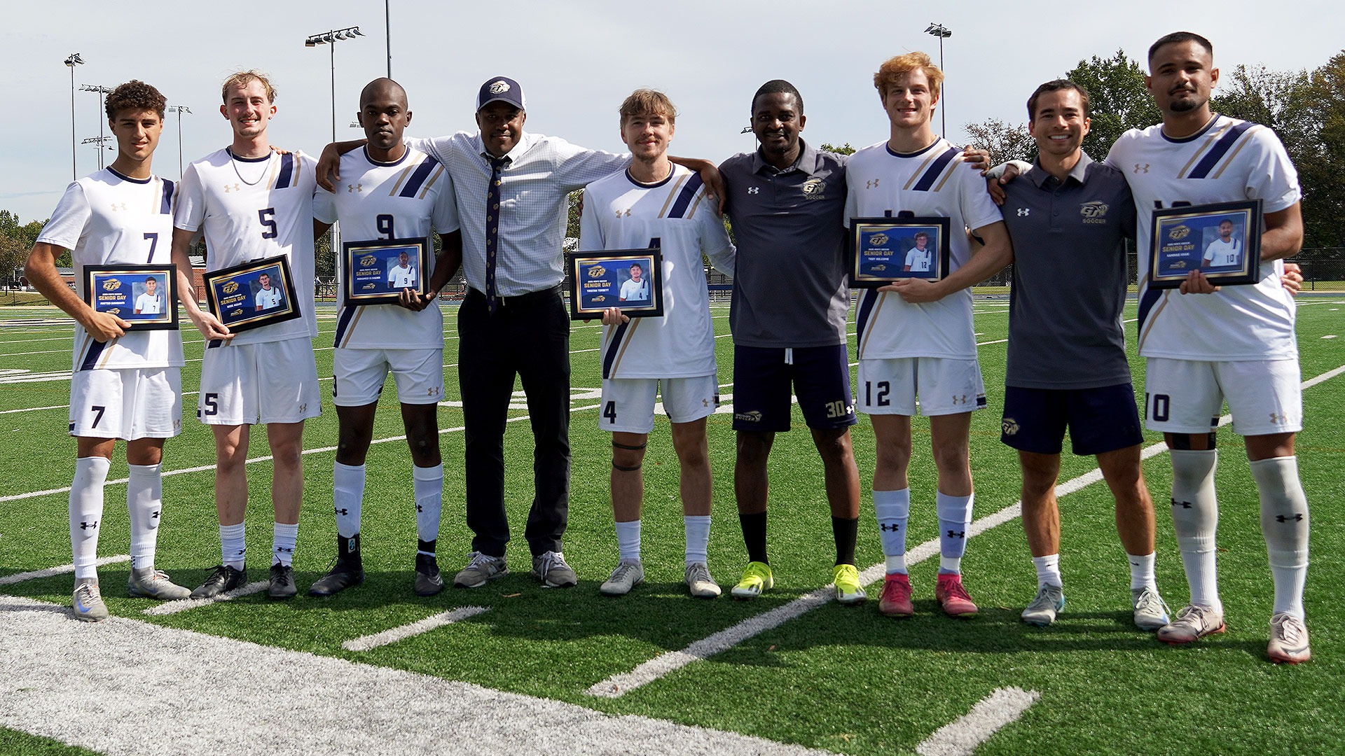 Gallaudet men's soccer senior day group photo with the coaches.