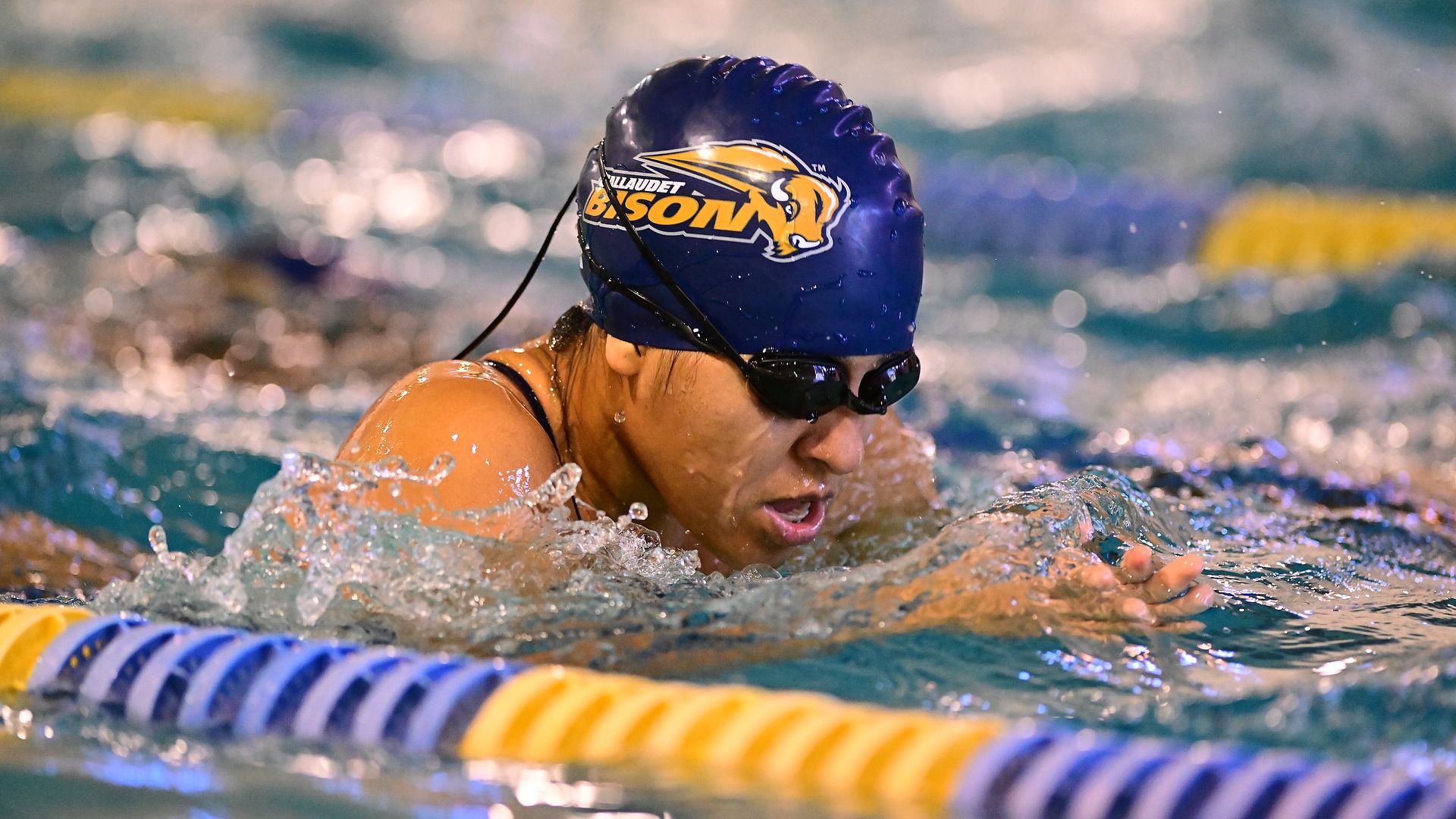 Gallaudet women's swimmer Melany Salcedo Benavides performs the breaststroke in the Field House pool during a home meet during the 2025-26 season.