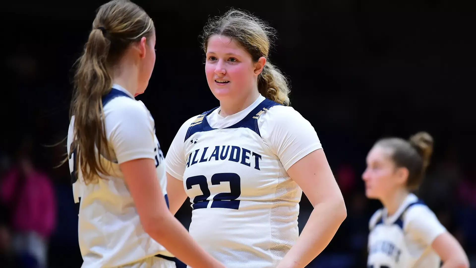 Gallaudet women's basketball players Mackenzie Schirg and Sophia Wascher is pep talking during a home game in the Field House against Washington Adventist University.