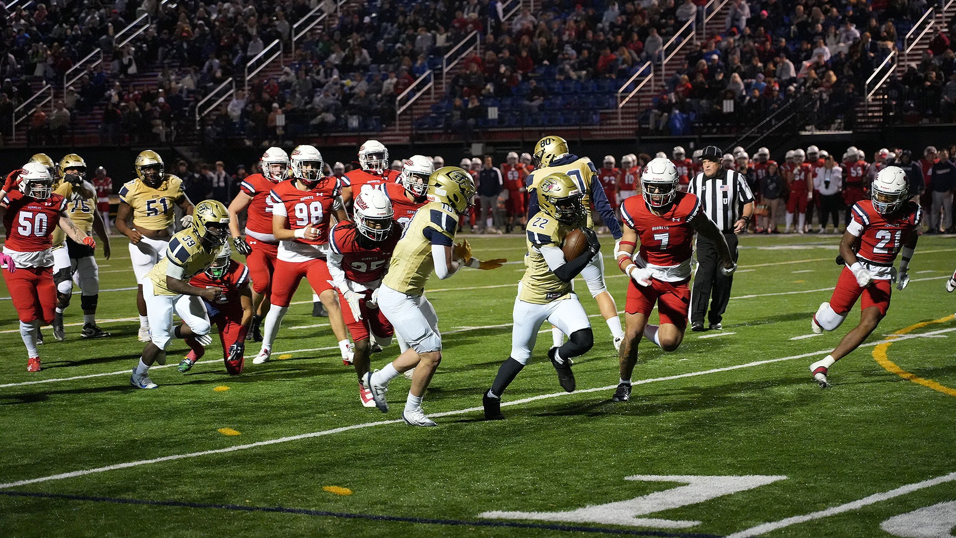 Gallaudet football player Dakota Fisher makes a touchdown run during a night game at Shenandoah University.