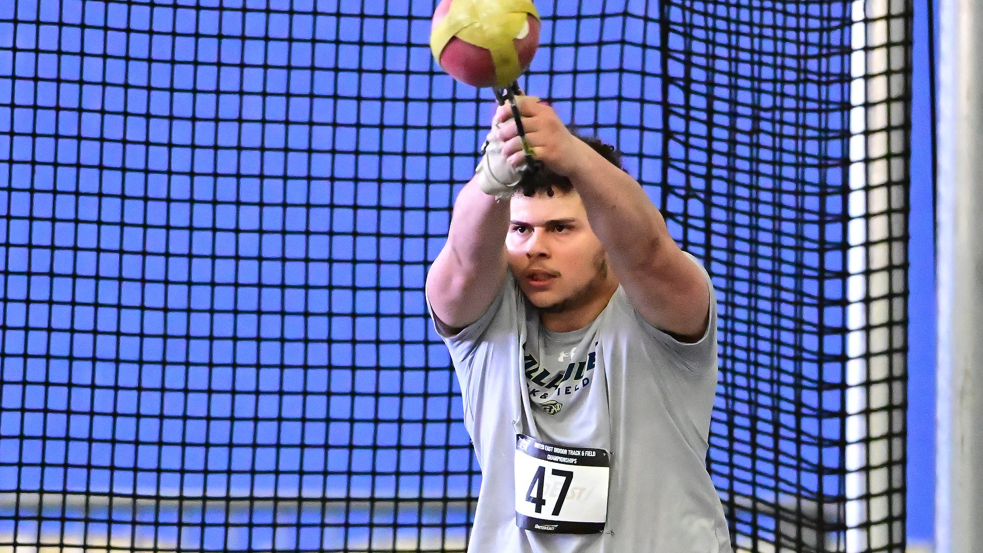 Gallaudet thrower Andrew Suarez attempts to throw the weight throw in close up 