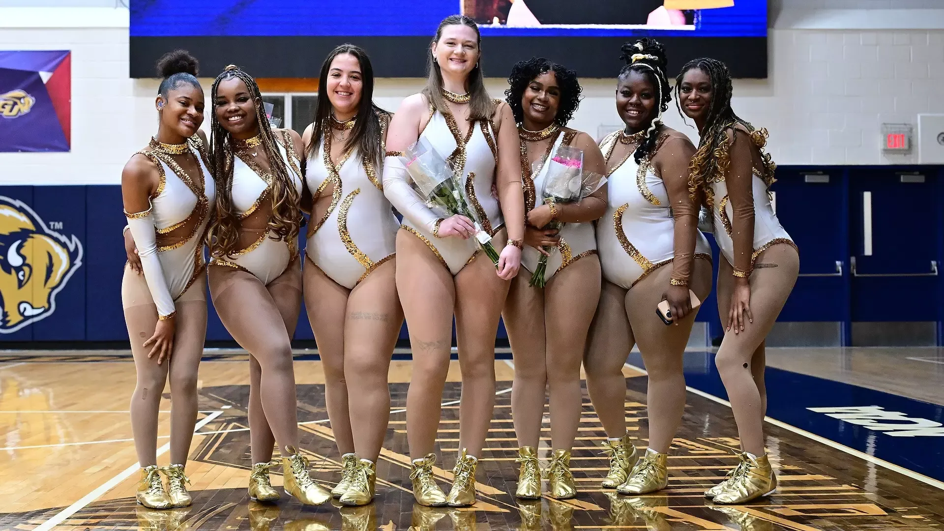 Gallaudet's Motion Z dance team takes a group photo together during Senior Day for the graduating seniors in the Field House.