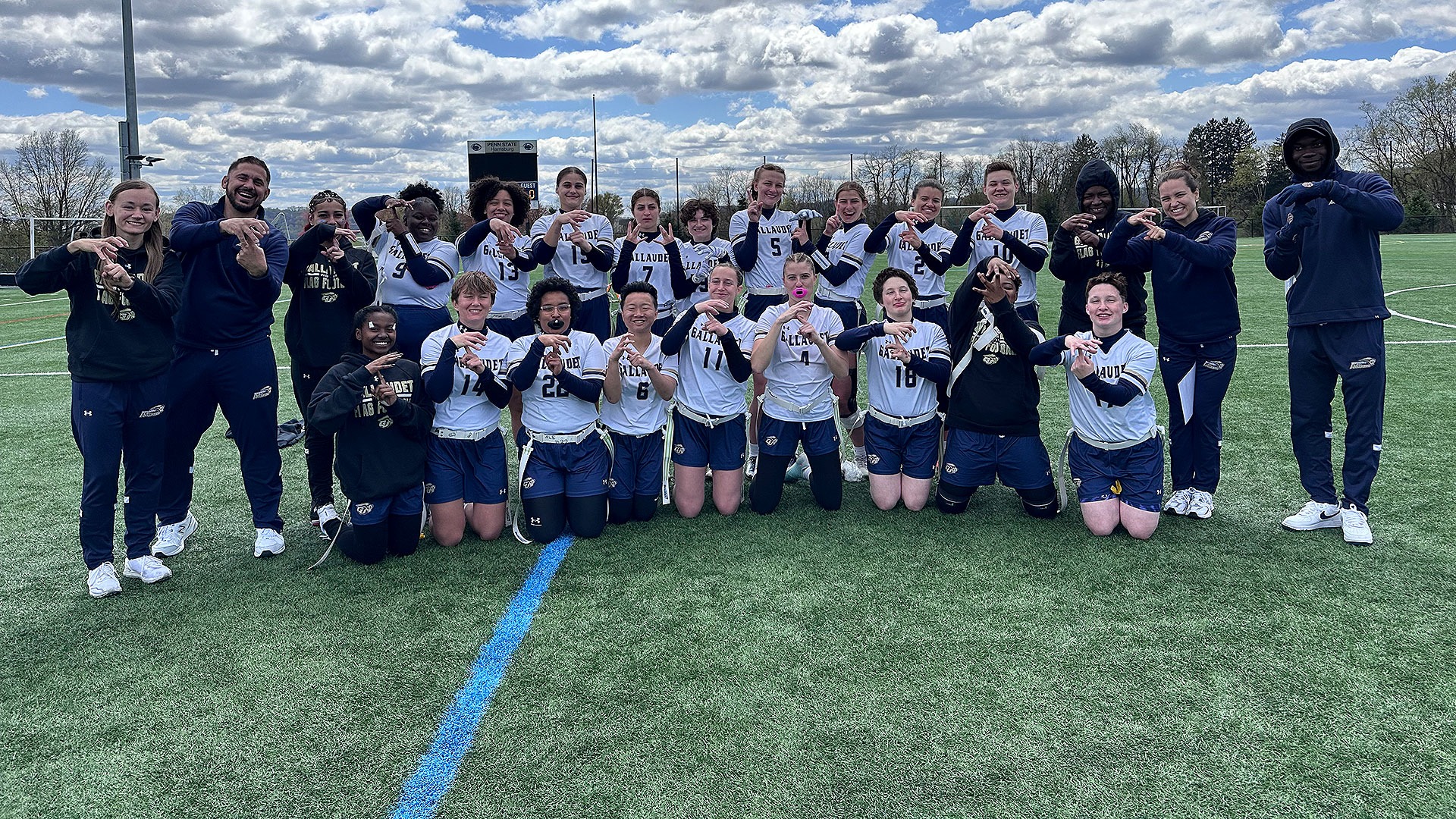 Gallaudet University women's flag football team pose for a group photo after they won the UEC tournament championship.
