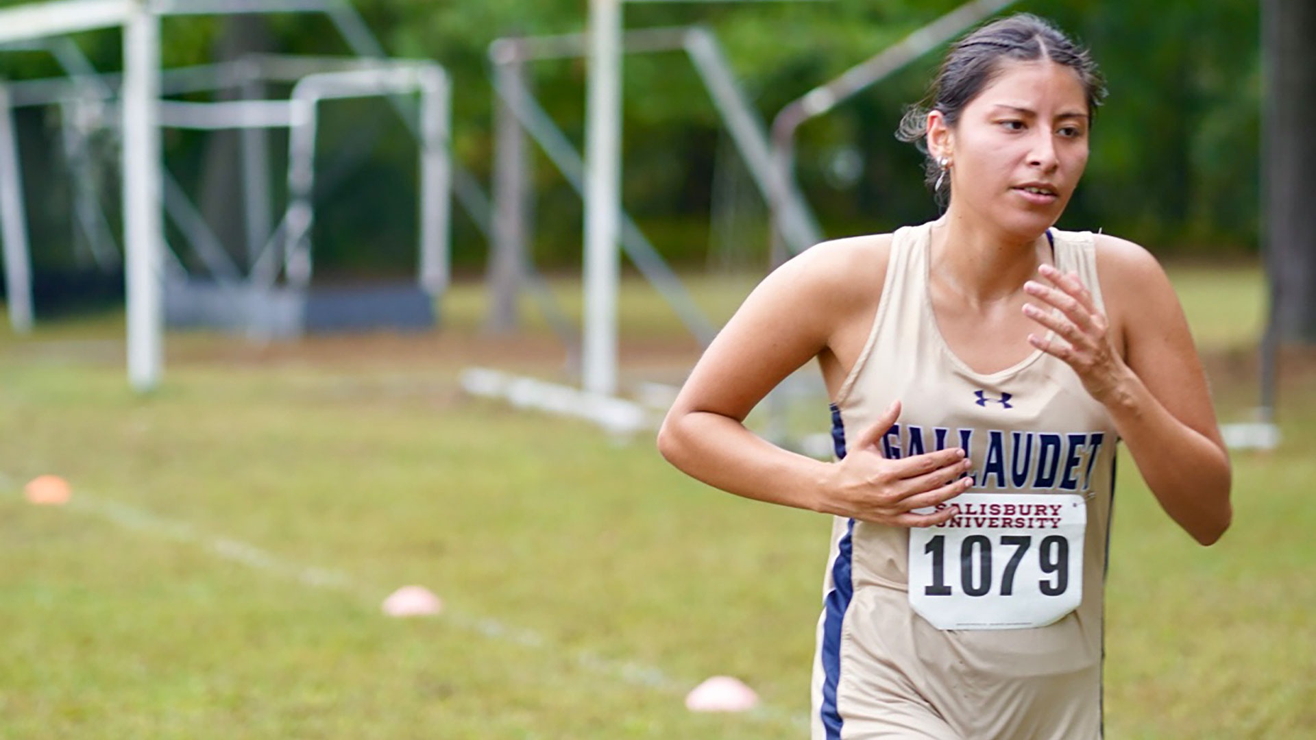 Gallaudet women's cross country runner Ashley Morales-Juan runs at a Salisbury University meet on an overcast afternoon.