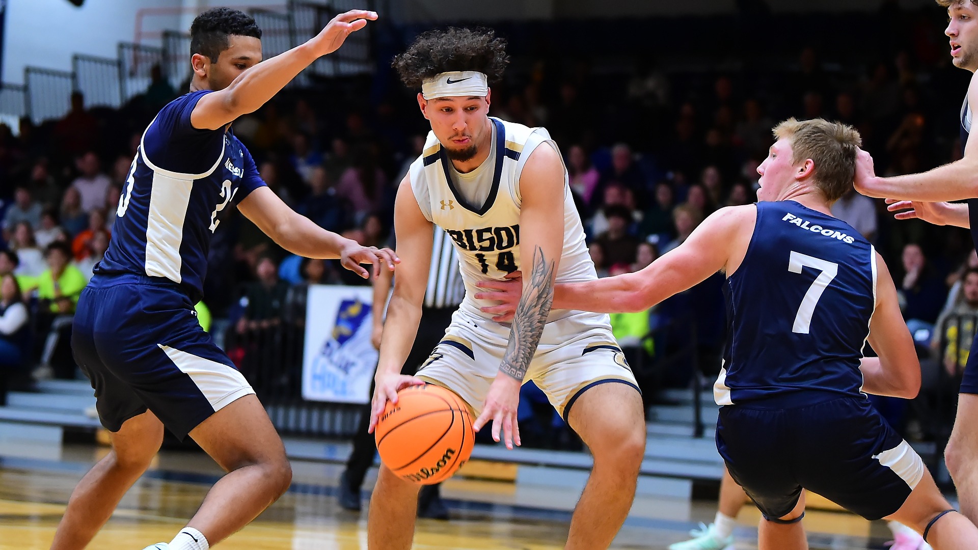 Gallaudet men's basketball player Keanu Ray Boren drives into the paint against Messiah College in the Field House trying to score a basket.