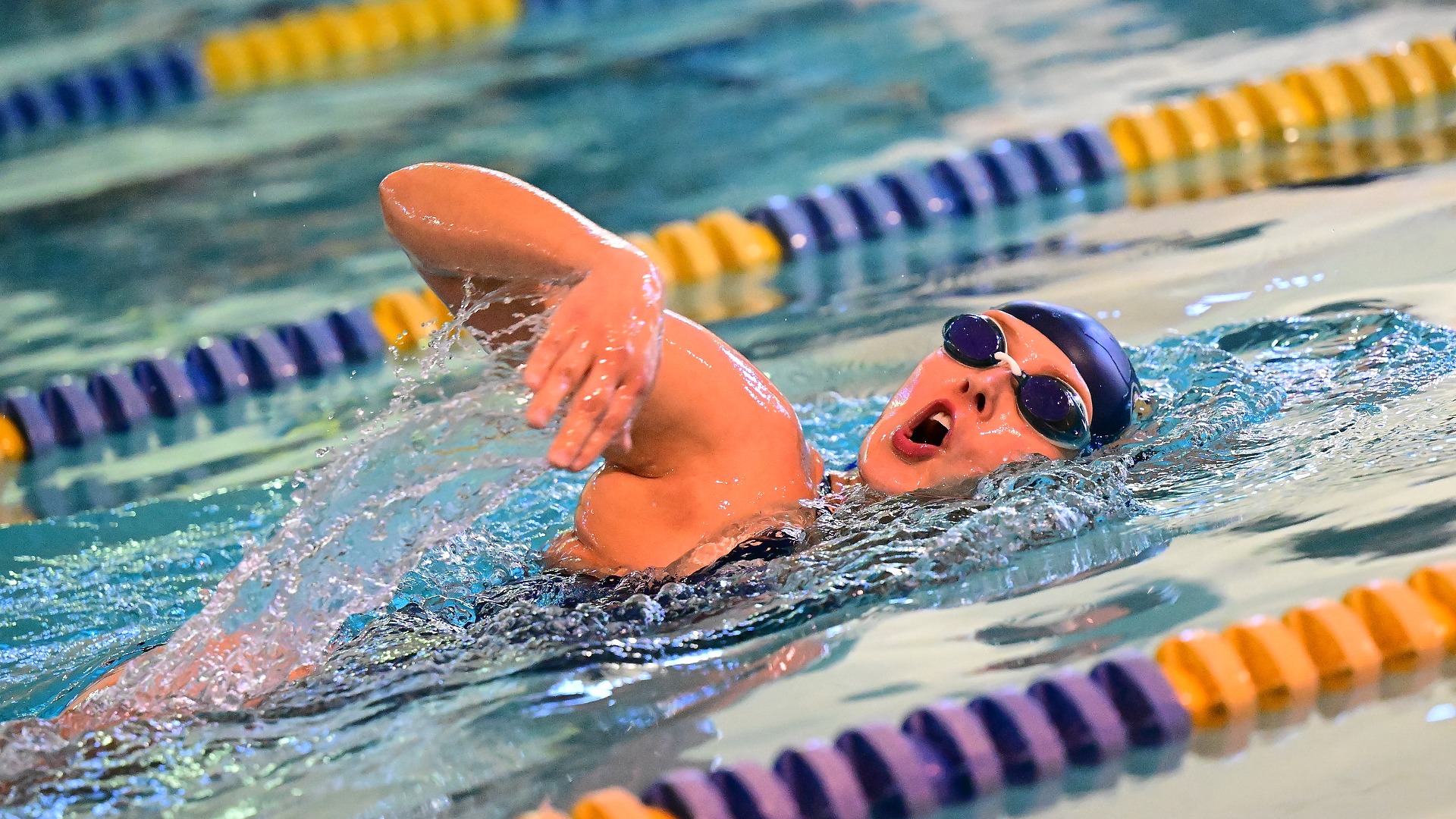 Gallaudet University women's swimmer Alecia Miller swims the freestyle event in the Field House pool.