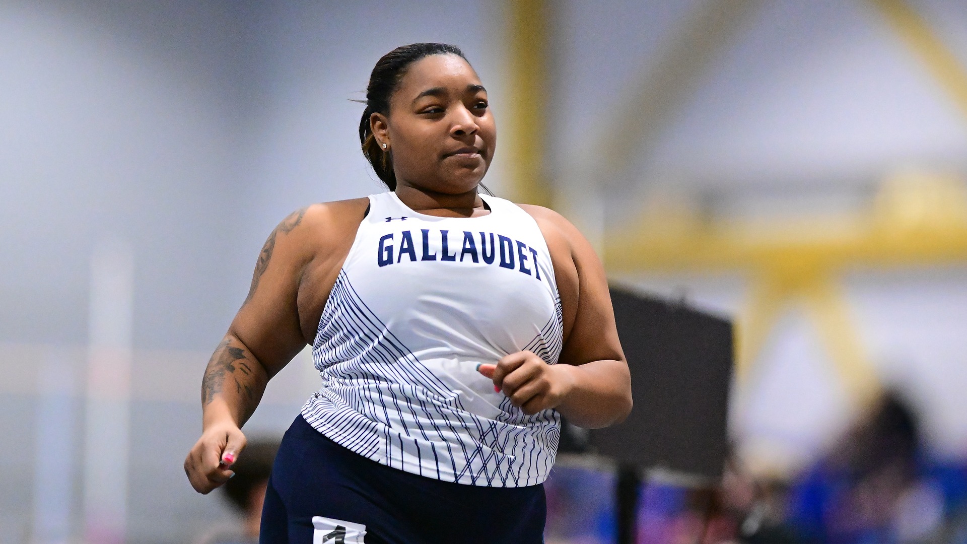 Gallaudet University women's indoor track and field runner Tori Cushshon competes in an indoor meet. 