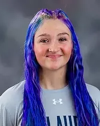 Kayla Gordon - 2026 Gallaudet men’s volleyball headshot. The Bison team manager wears a gray t-shirt and looks towards the camera. A gray backdrop is in the background.
