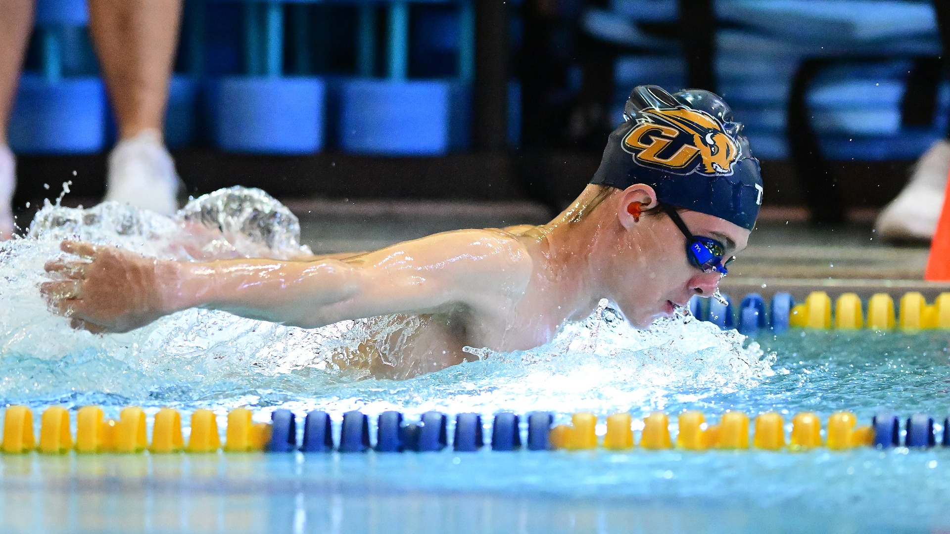 Gallaudet men's swimmer Alex Wilding swims the butterfly stroke in a home meet in the Field House pool.
