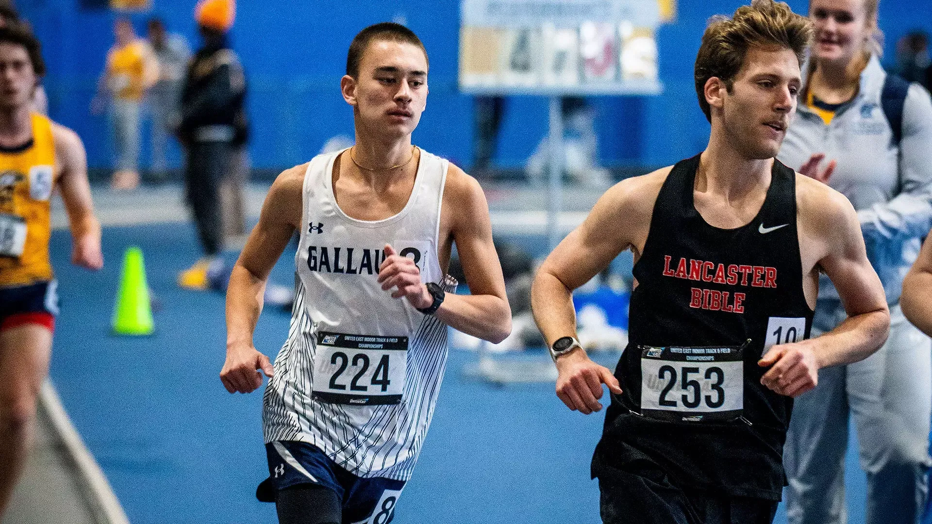 Gallaudet men's indoor track runner Sevan Ikeda runs in a race at the 2026 United East championships. Ikeda is in the middle of the photo as he is right behind the Lancaster Bible College runner David Helms. 