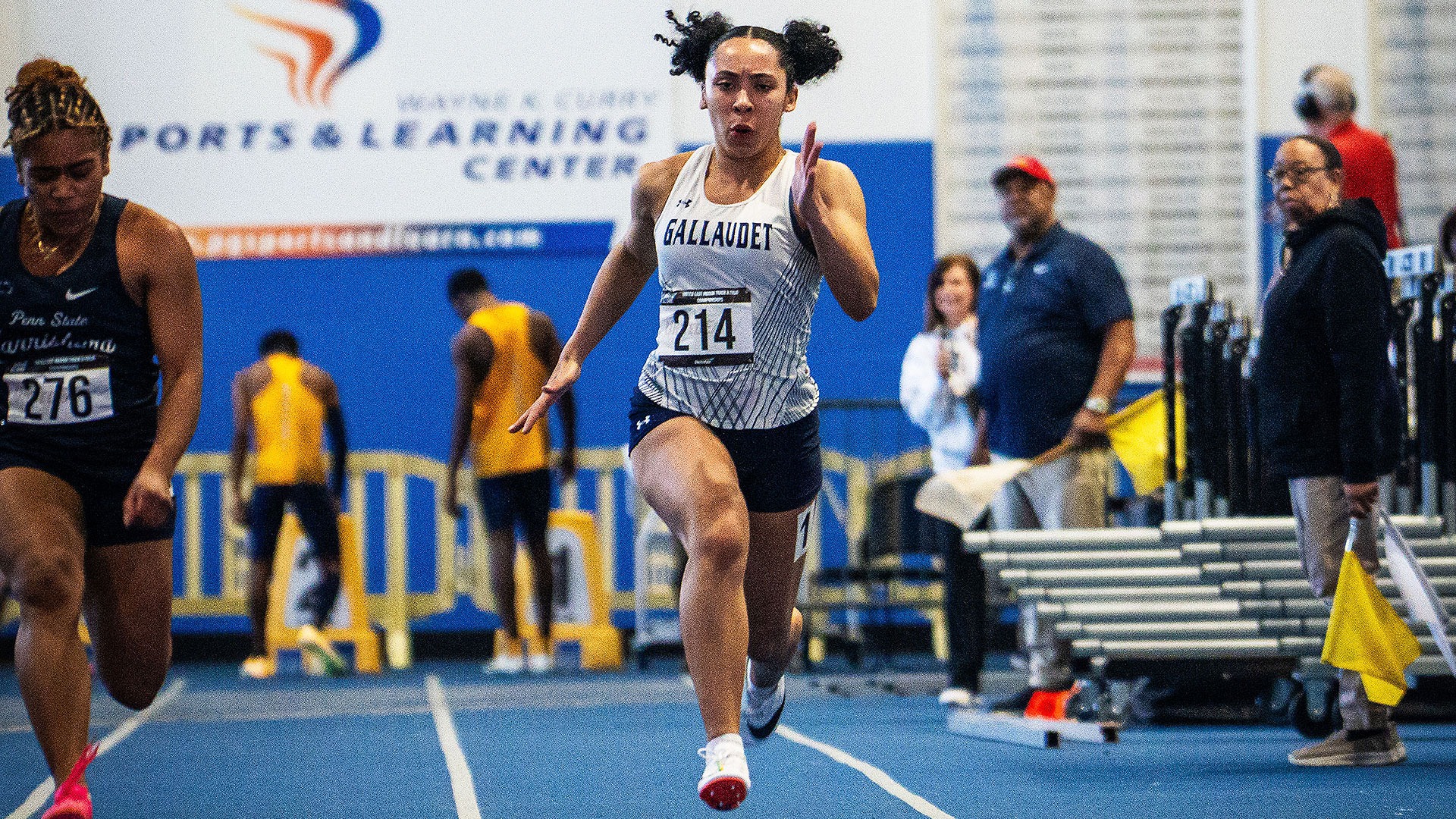 Gallaudet women's indoor track and field sprinter Brooke Carter runs in an event at the 2026 United East championships. Carter is sprinting down the lane towards the finish line.