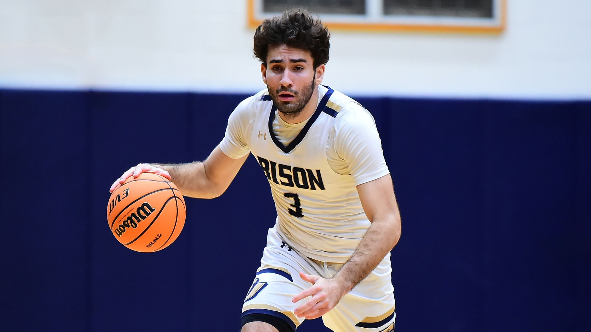 Gallaudet men's basketball guard Samer Sawan dribbles the ball up the court during a home game in the Field House.