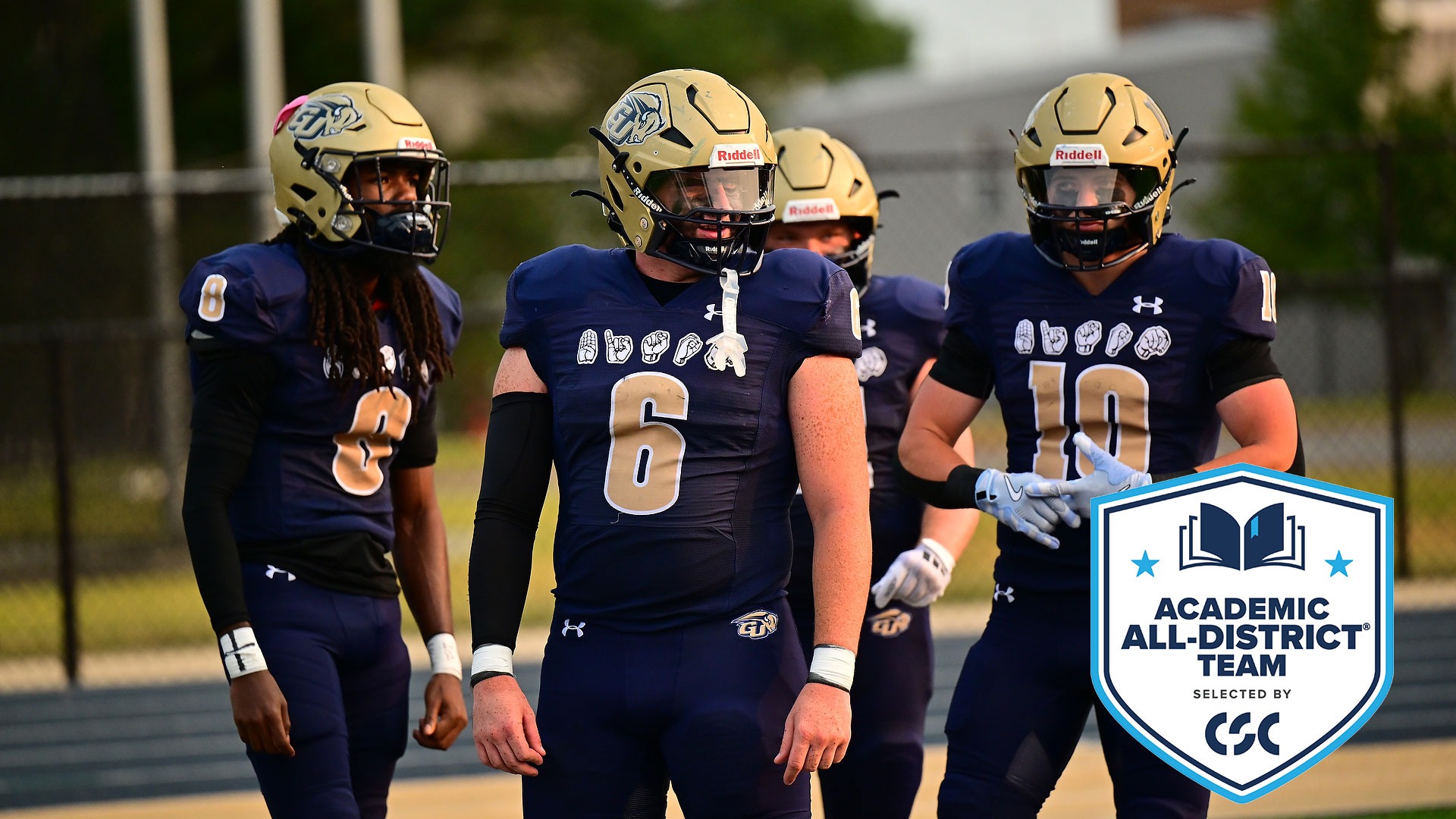 Gallaudet football players Jacob Hundley (middle wearing #6 jersey) and Carter Johnson (right, wearing #10 jersey) warm-up before a home game at Hotchkiss Field. A CSC Academic All-District logo is in the lower righthand corner.