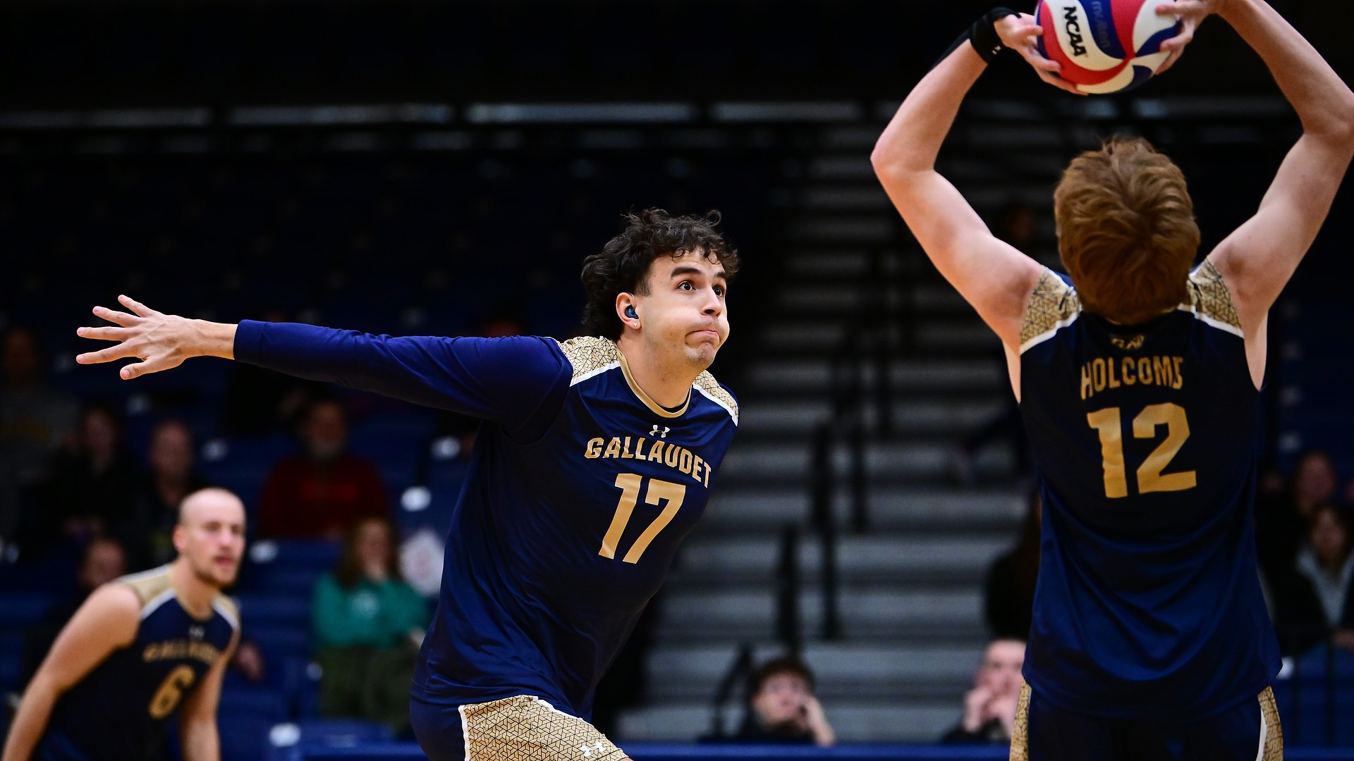 Gallaudet men's volleyball player Luke McBrine prepares to leap for an attack attempt in a home match in the Field House.