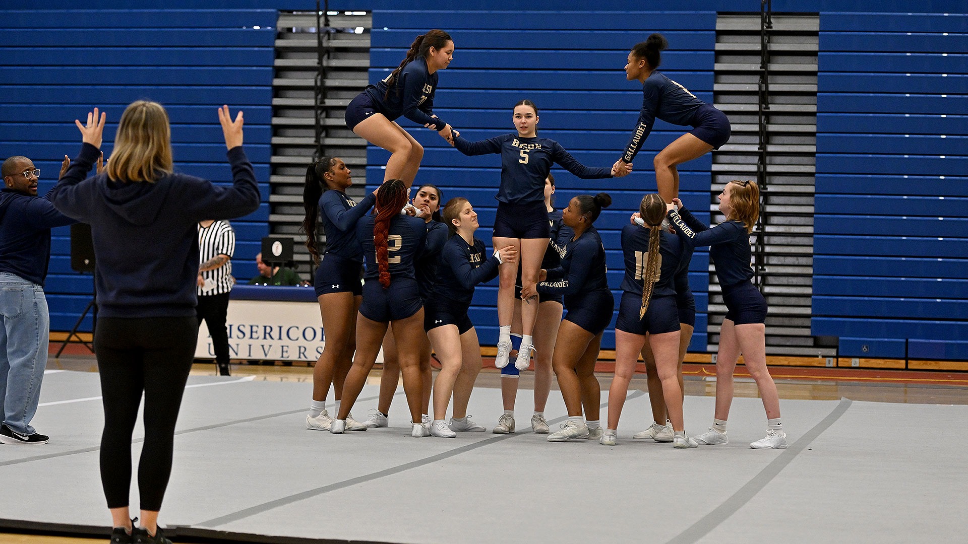 Gallaudet STUNT members perform at a competition on the campus of Misericordia University in Dallas, Pa., on March 15, 2026. The Bison student-athletes are in the middle of making a pyramid.