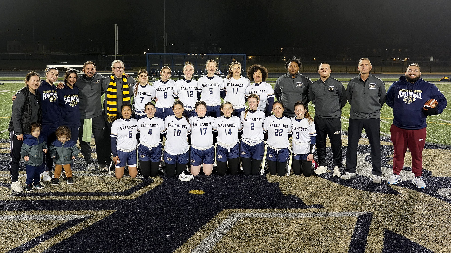 Gallaudet's 2026 Women's Flag Football Team pose for a group photo after a night game against Lancaster Bible College.