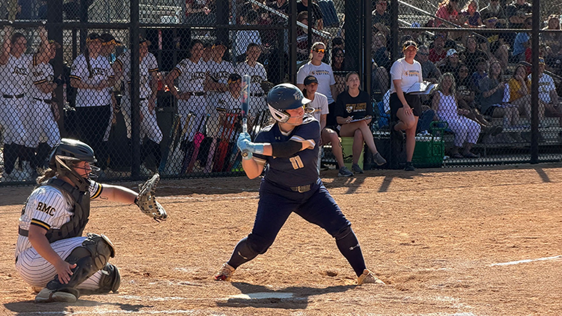 Gallaudet softball player Kinsley Bond attempts to hit in at the plate on a sunny, warm day in North Carolina as the Bison play Meredith College.