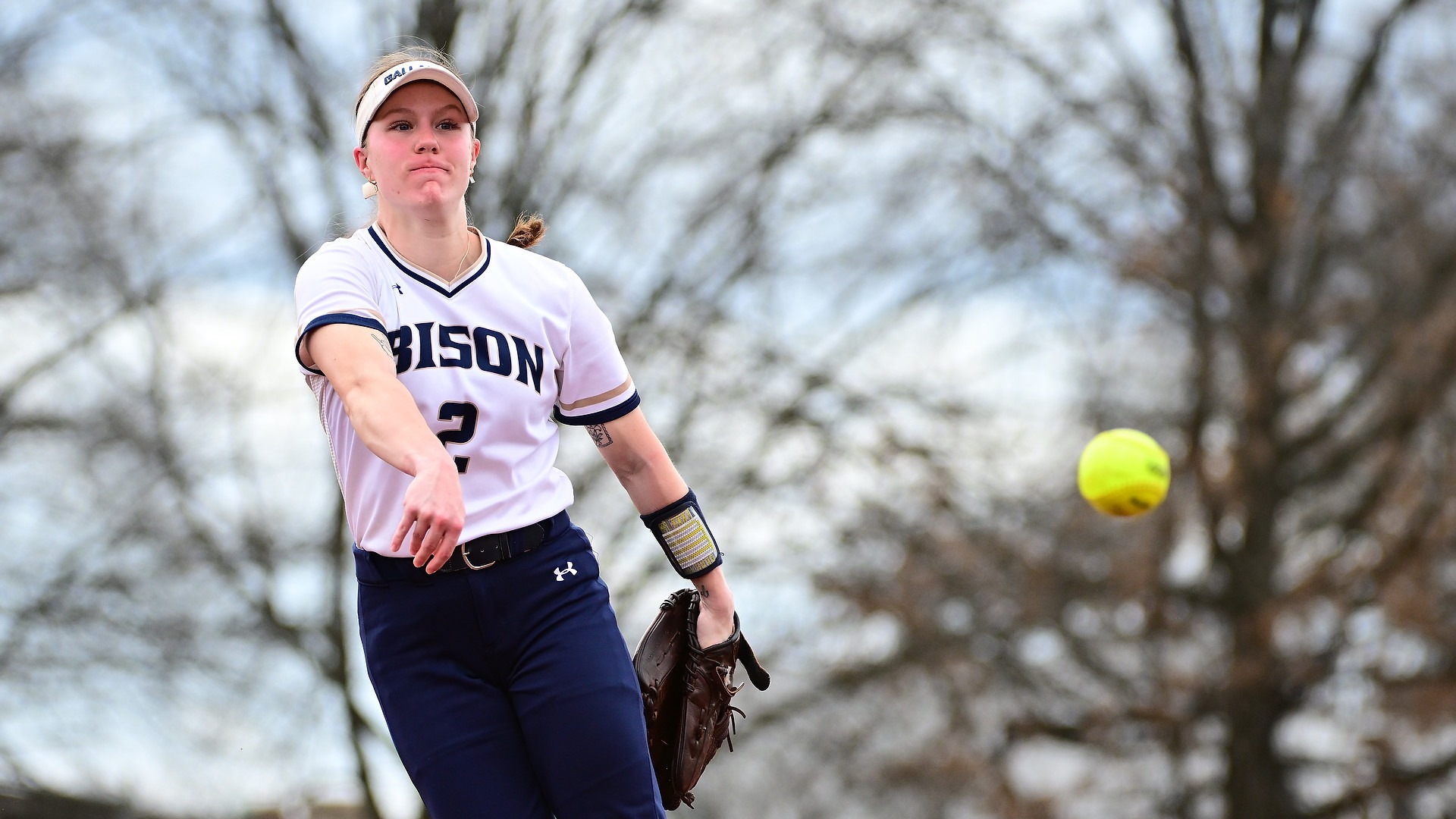 GU softball pitcher Lacey Drolsbaugh is pitching during an afternoon sunny game at home.