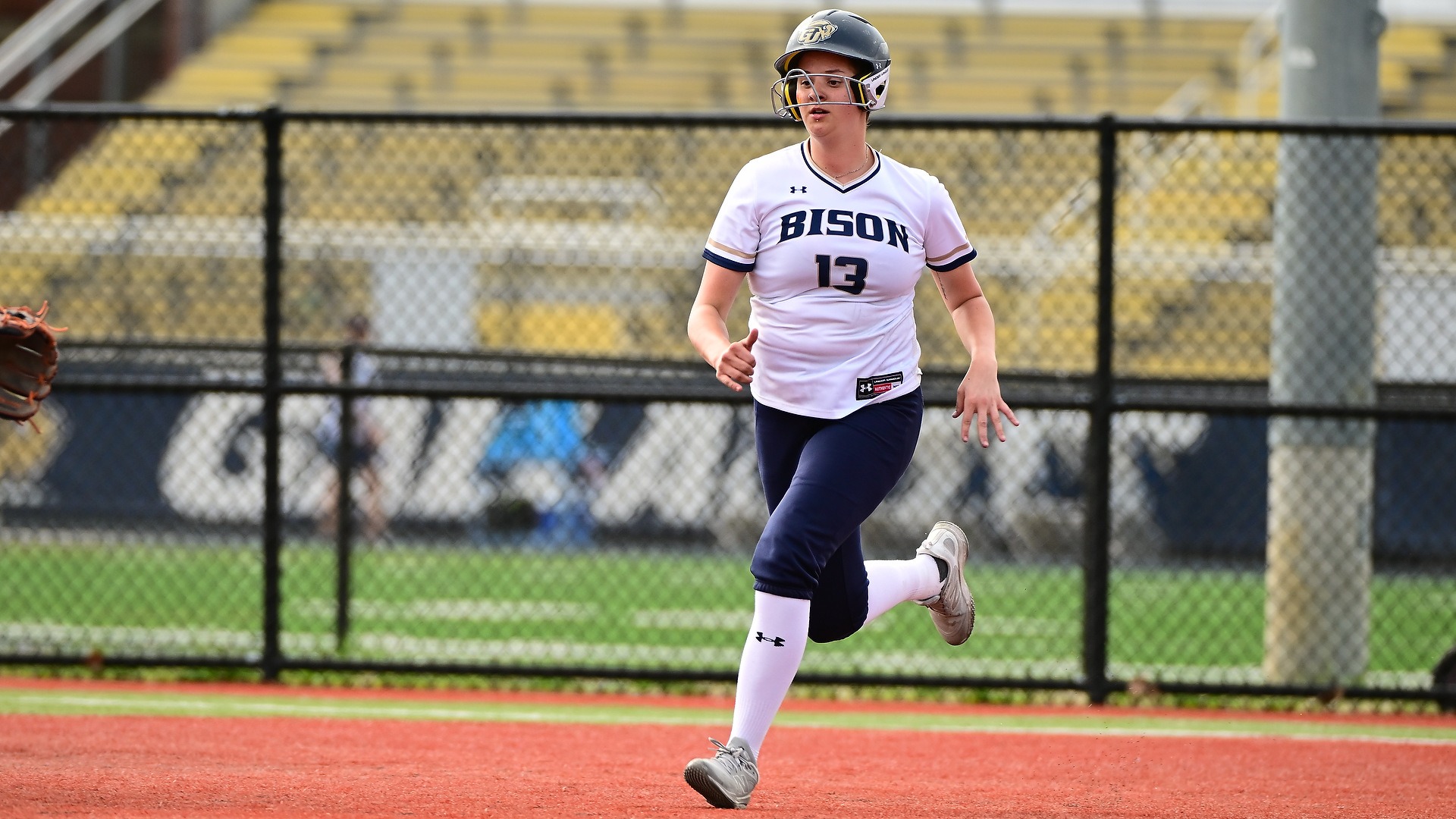 Gallaudet softball player Mattea King runs into second base in home game at GU Softball Complex