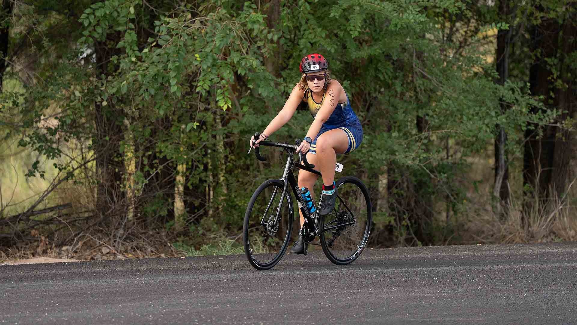 Gallaudet triathlete Priya Frank bikes on a bike at the Desert's Edge Collegiate Cup in Colorado on Sept. 27, 2026, in the morning. 
