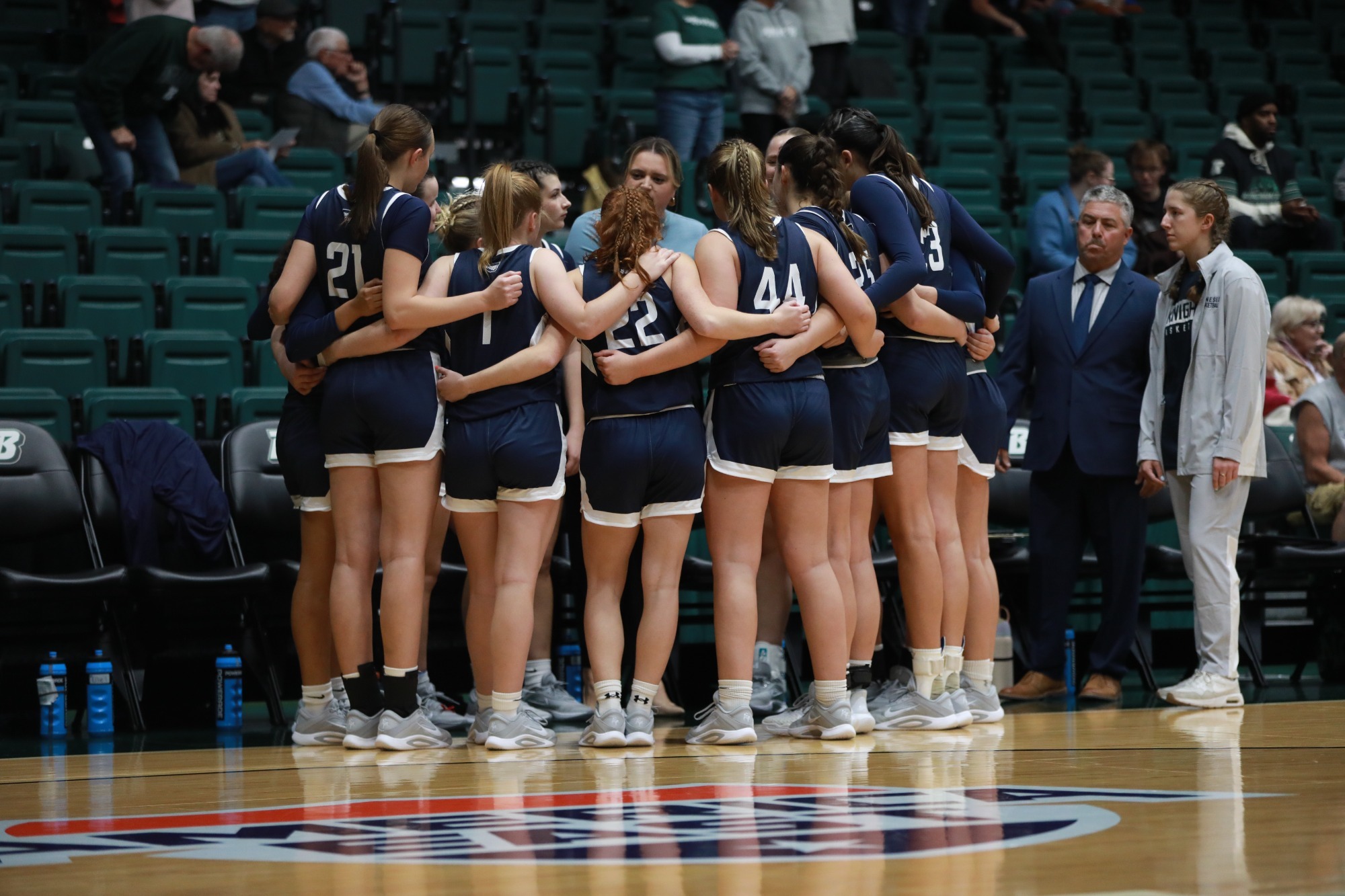 women's basketball team huddle