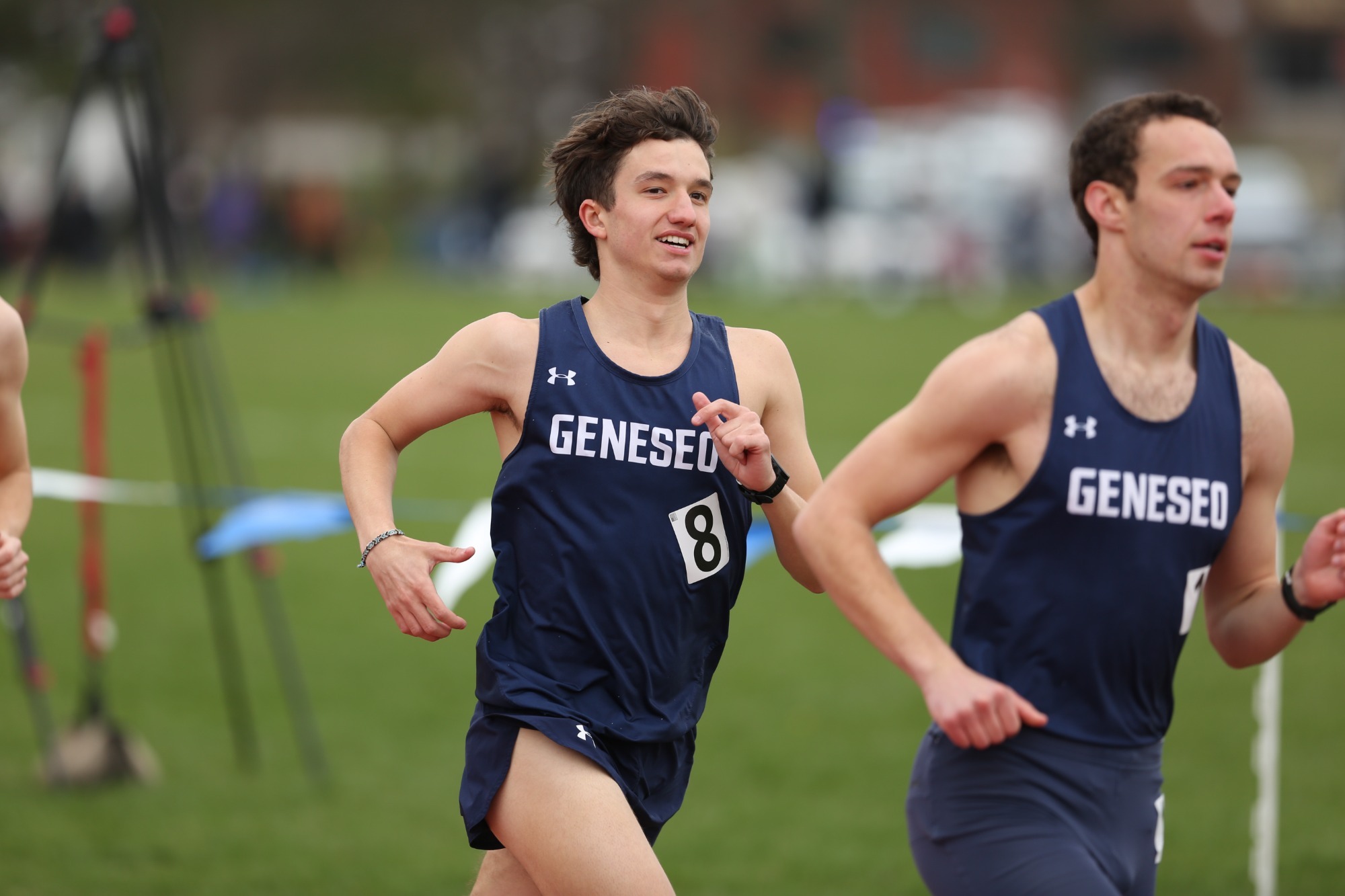 Outdoor track and field home invitational action photo distance event