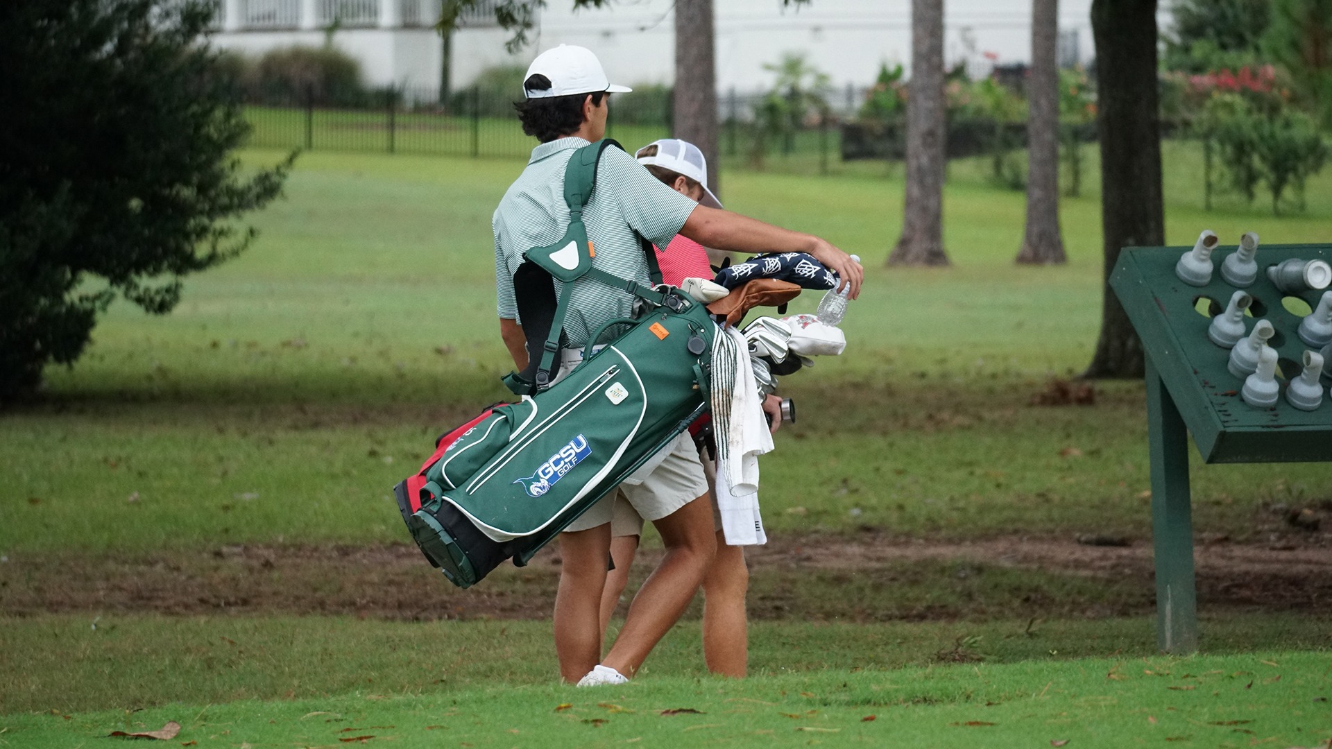 Andy Scott carrying his golf bag