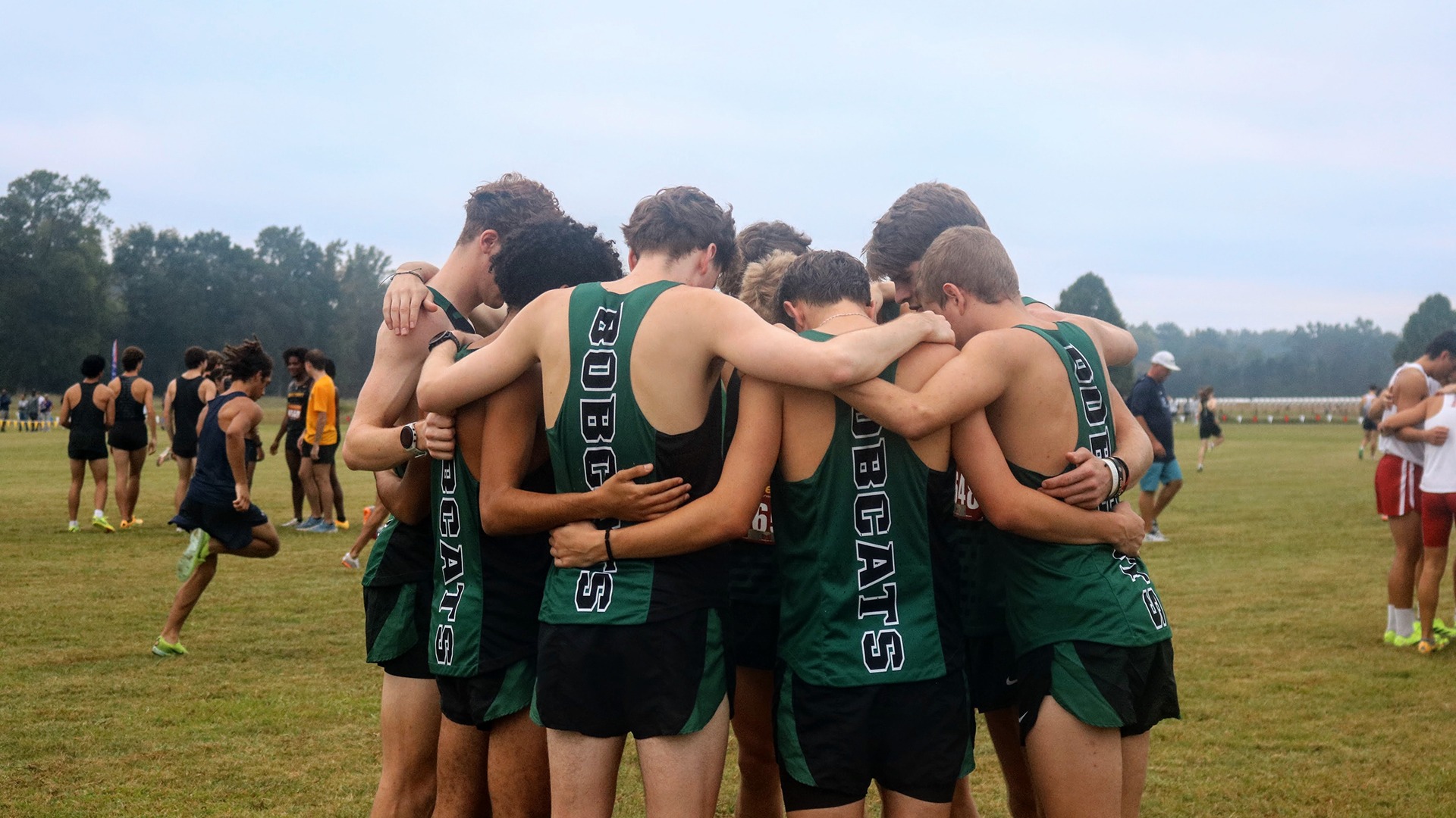 Men's Cross Country huddle