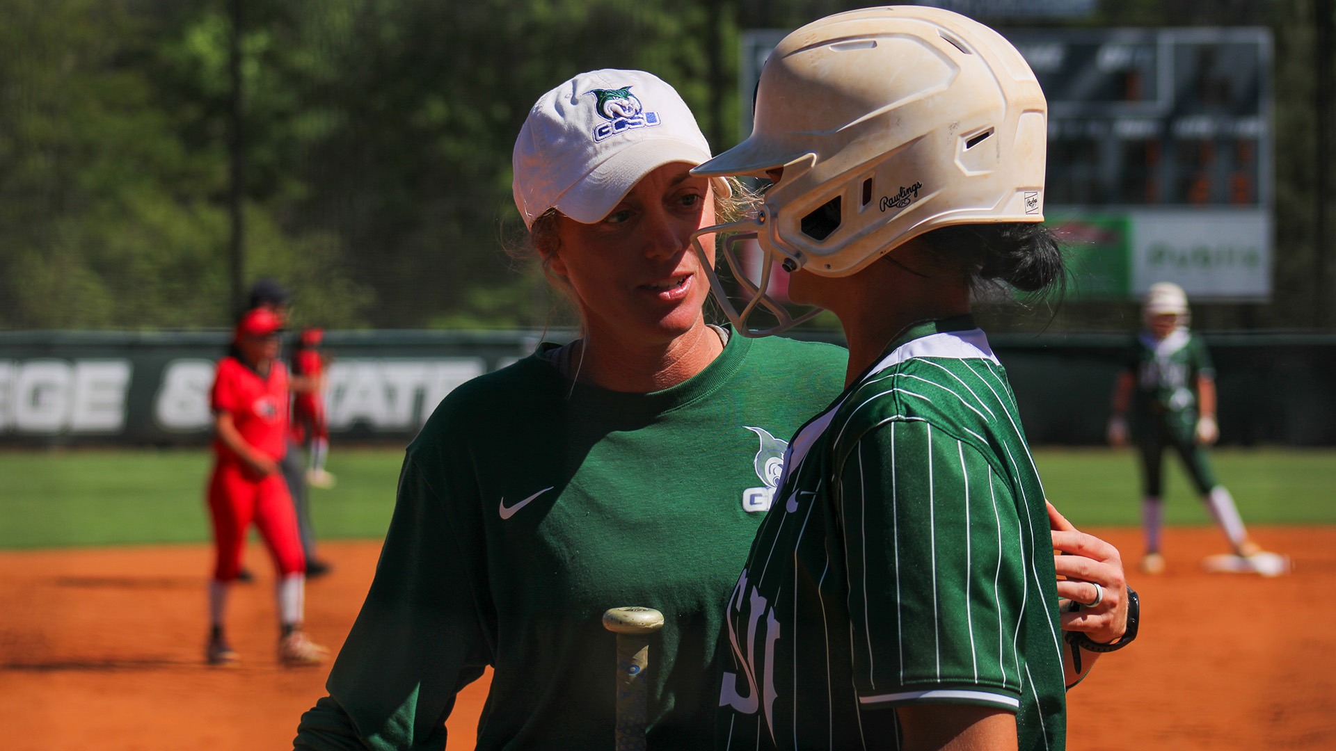 GCSU head coach Brittany Johnson talking over strategy with one of her players