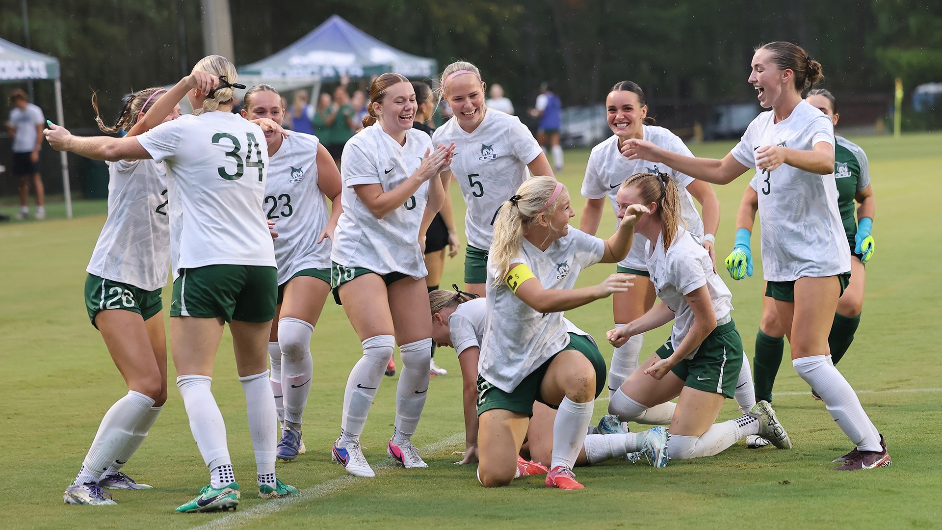 Celebration after Savannah Sause scored first goal in 5-0 win over North Greenville