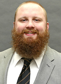 Assistant track and field coach Matt Logan's headshot.