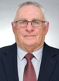 Assistant track and field coach John Grim's headshot