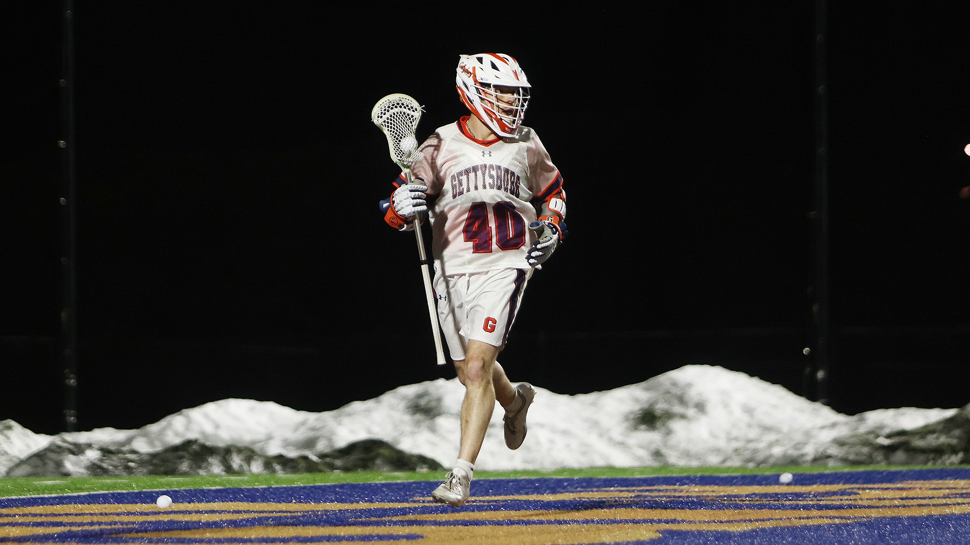 Ethan Kessler behind cage