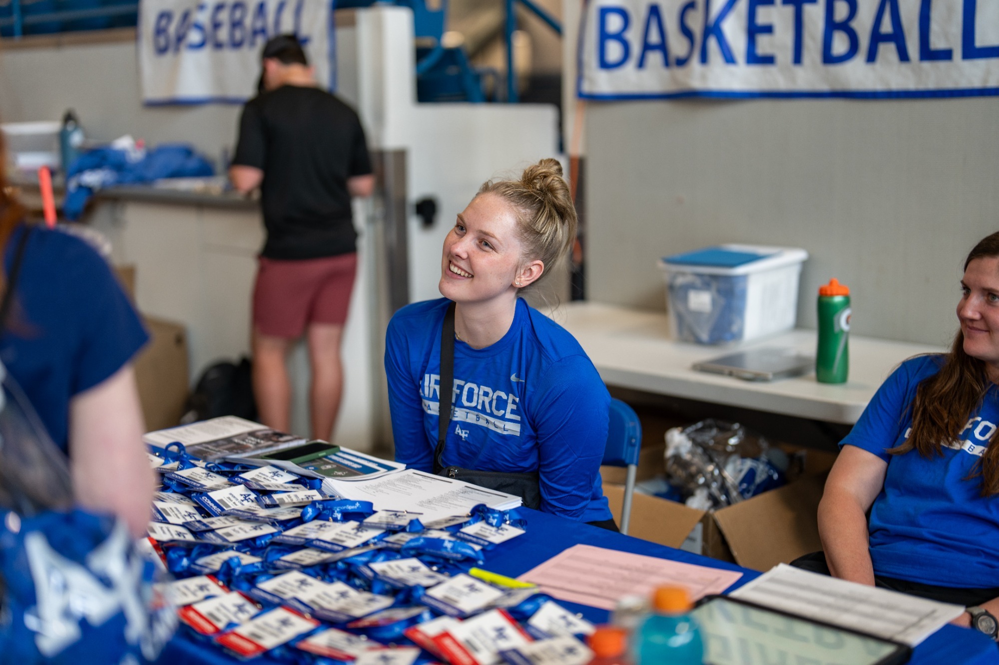 Air Force Sports Camps Coach Assisting With Camper Check-In