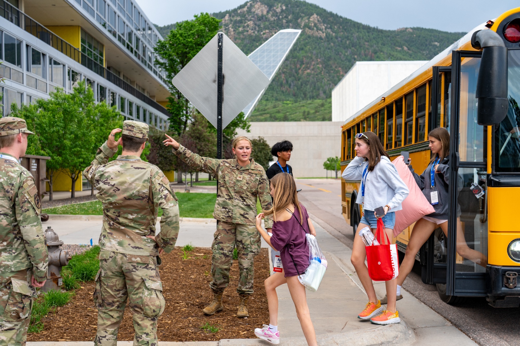 Air Force Cadet Helping Sports Camper Arrive