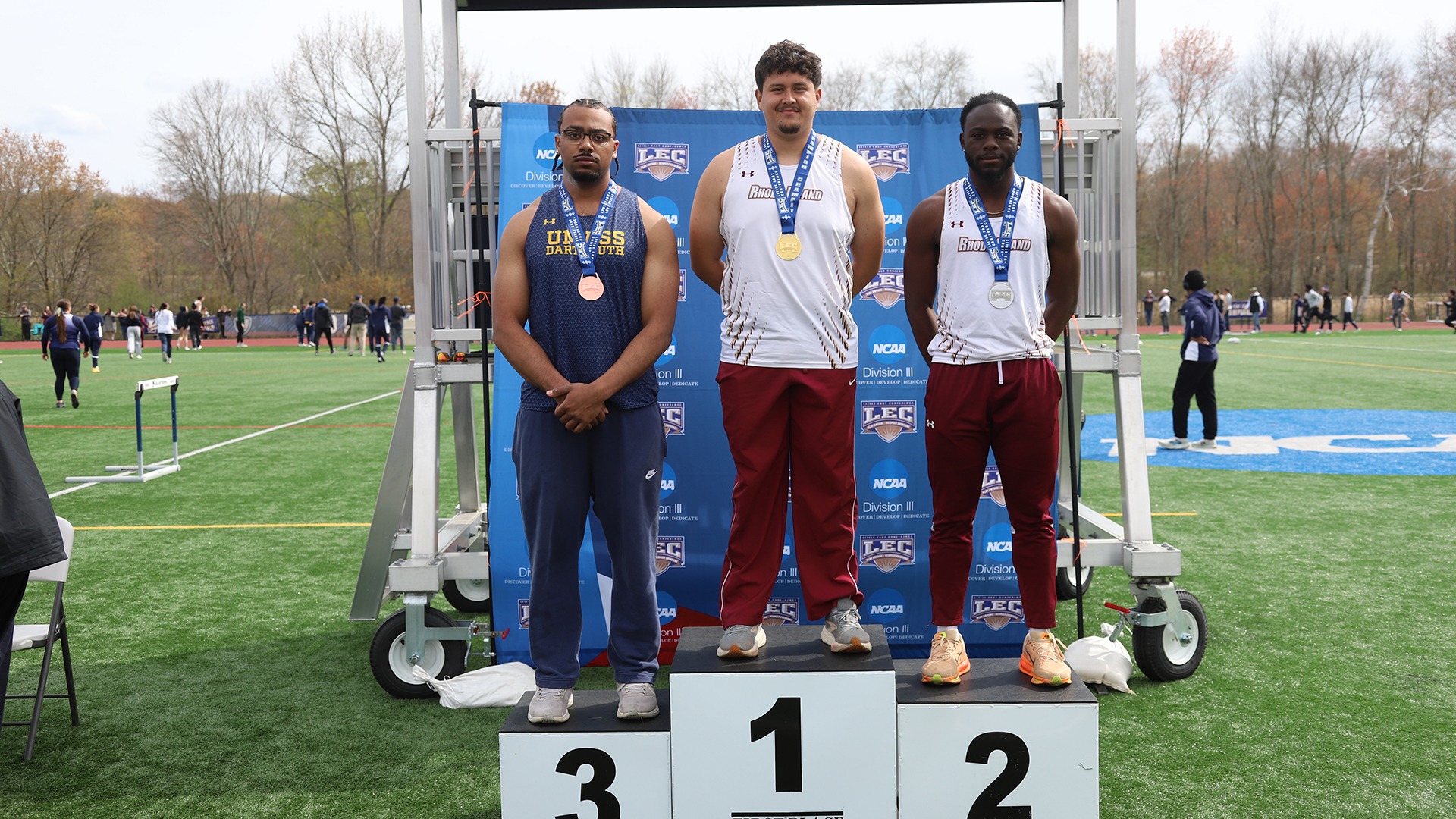 Brandon Mota and Enrique Edjang 2026 Little East Outdoor Track and Field Championship Podium Photo