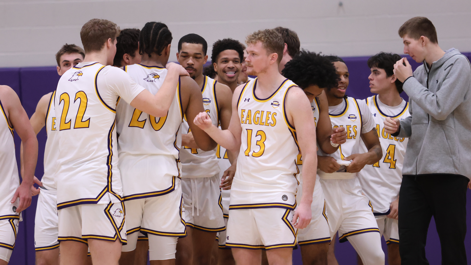 Men's Basketball Team Breaking a Huddle