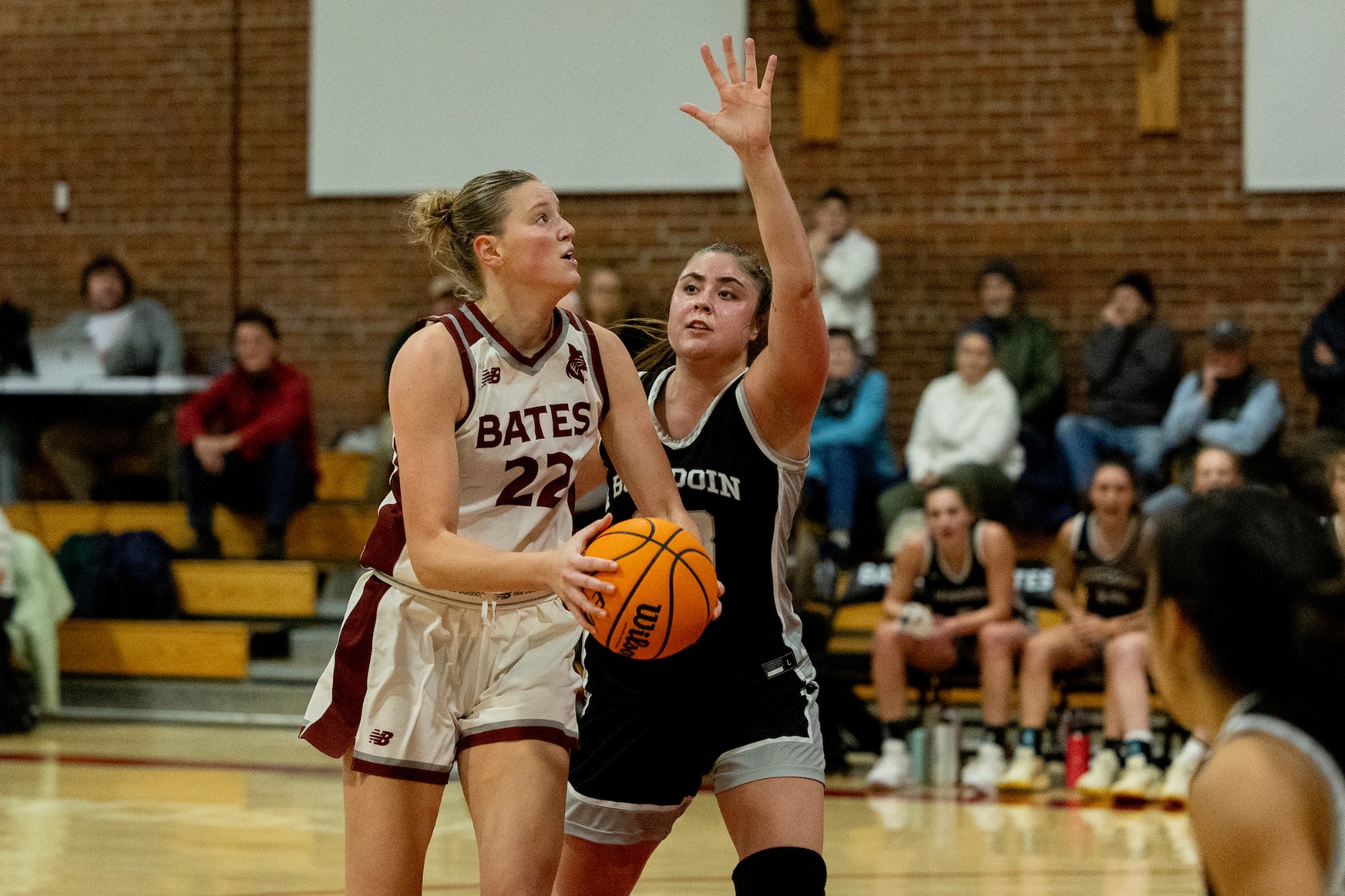 Elsa Daulerio | Junior guard Sarah Hughes delivered a moment the Alumni Gym crowd won't soon forget, drilling a half-court heave at the buzzer to force double overtime, but the No. 11 Bates women's basketball team fell just short in a 77–70 battle against No. 6 Bowdoin on Thursday night. It marked Bates' first double-overtime game since an 86–85 win over the University of New England on November 25, 2018.