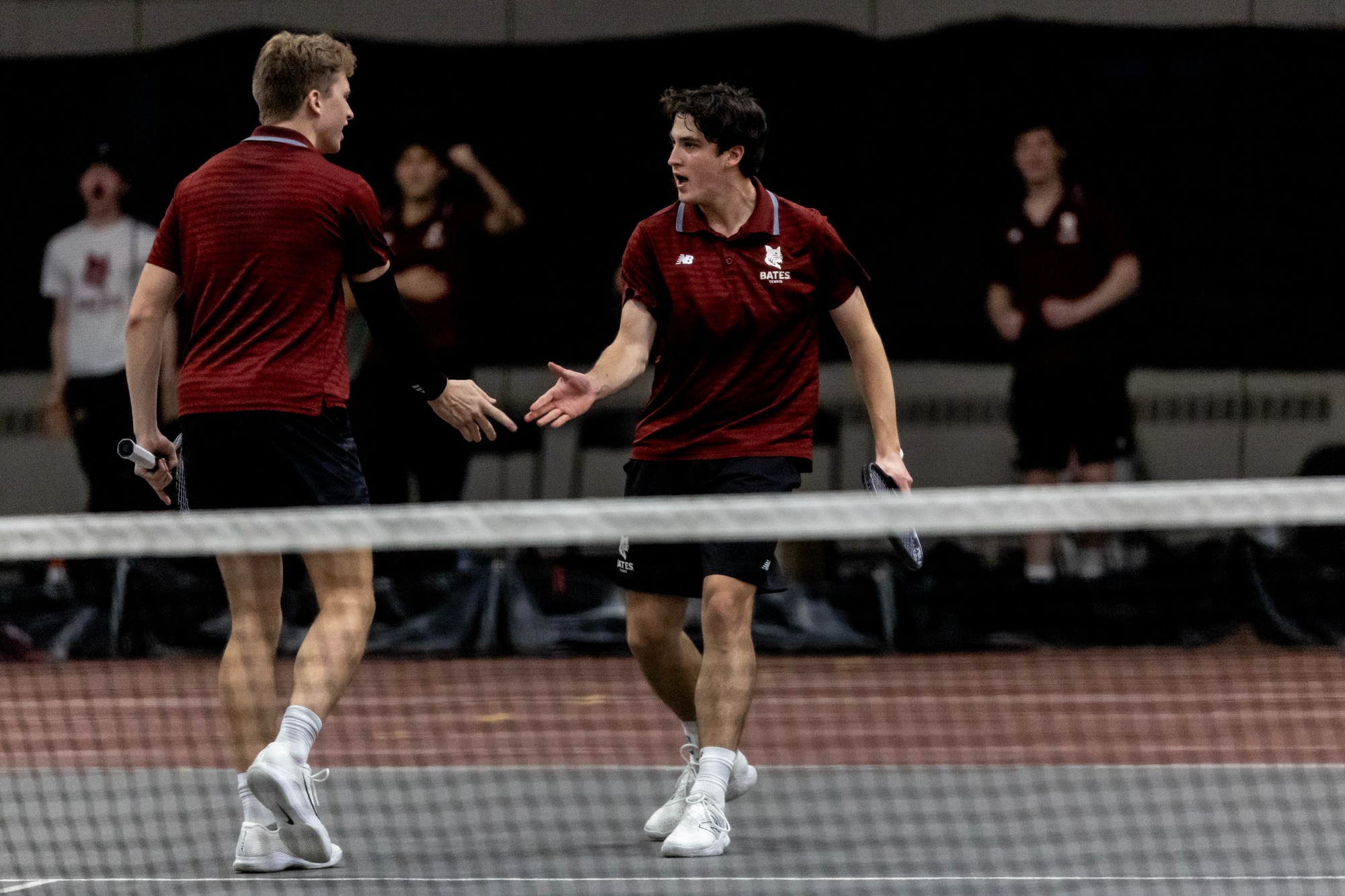 Men's_Tennis plays a match against Wesleyan in Merrill Gymnasium on April 13, 2025. Three seniors pose with Coach Paul Gastonguay ’89 before warmups.