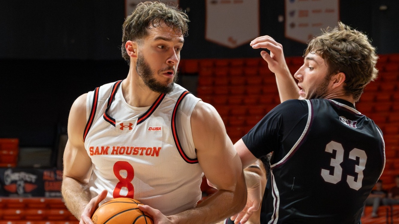 Velljko Ilic backs down a Schreiner defender