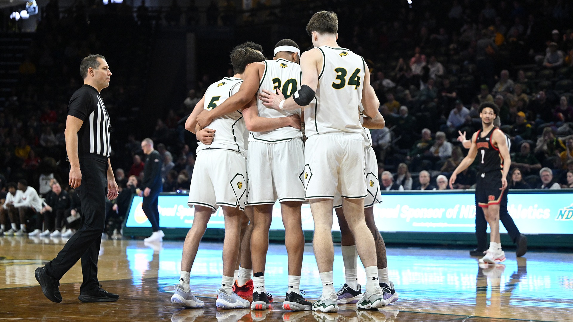 NDSU men's basketball team huddle