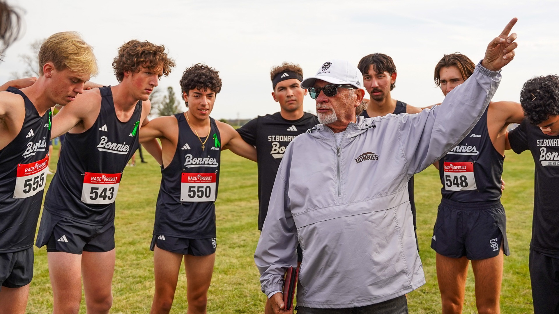 Bob Macfarlane cross country huddle