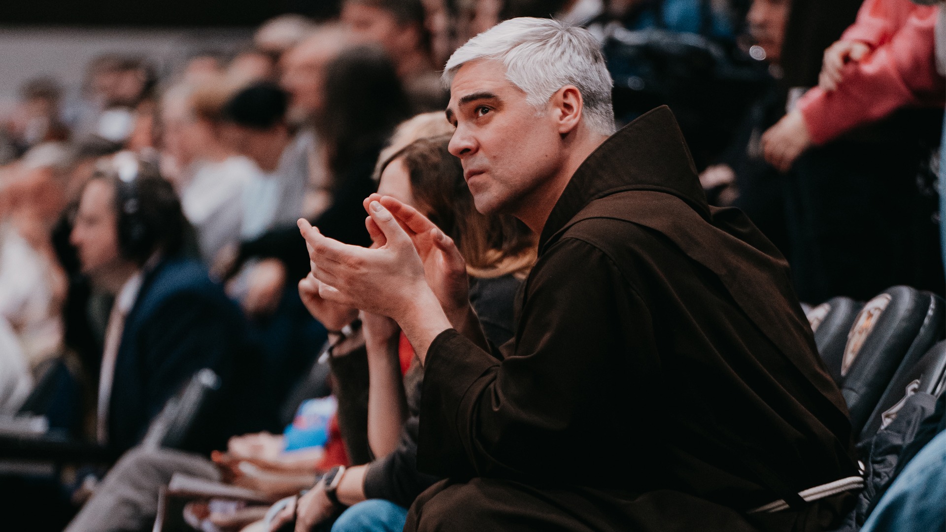Fr. Steve at men's basketball game