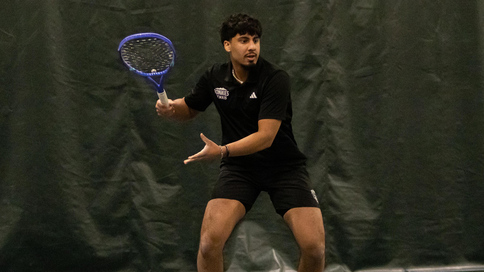 Dilraj Singh Dhillon hitting a forehand