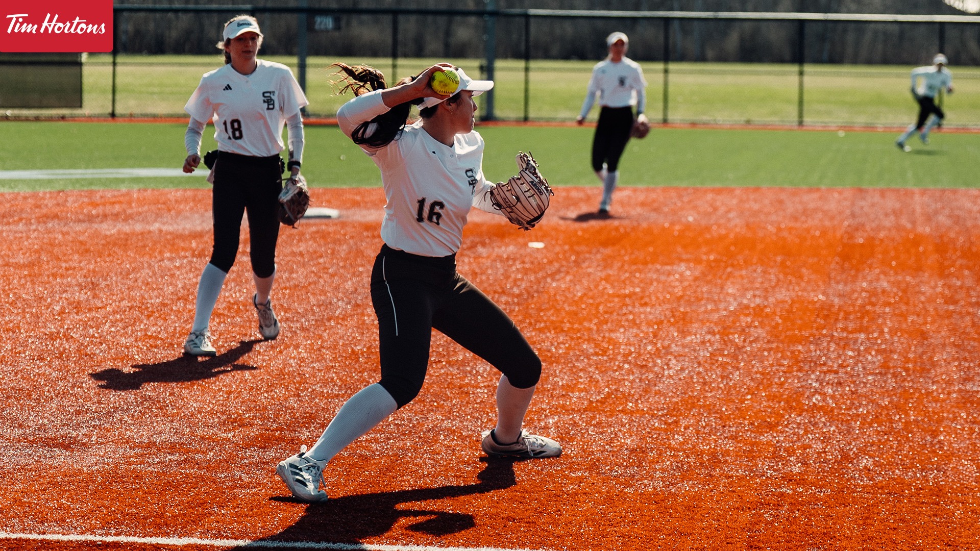 Kymora Wang throwing to first