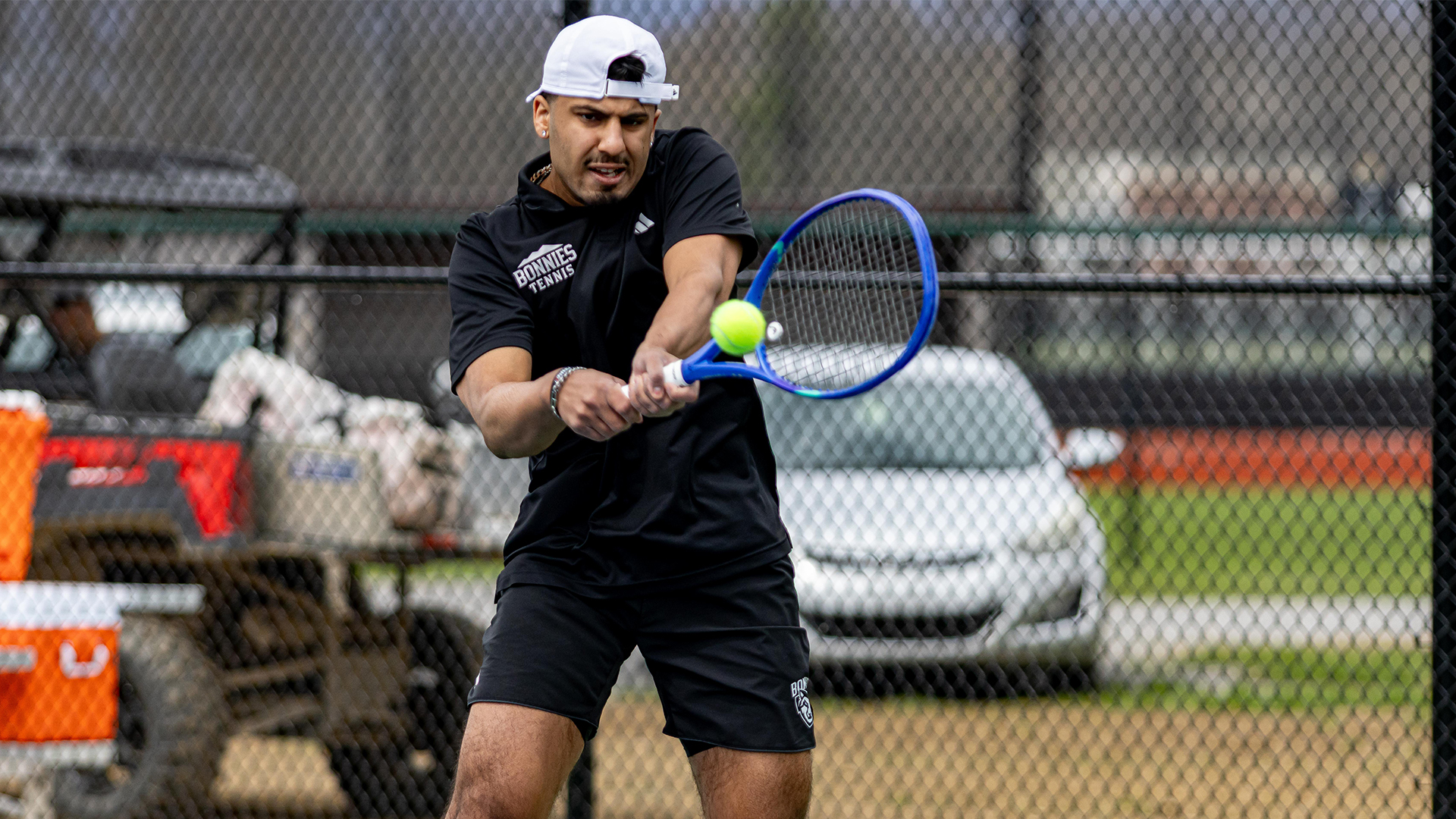 Dilraj Dhillon hitting a backhand