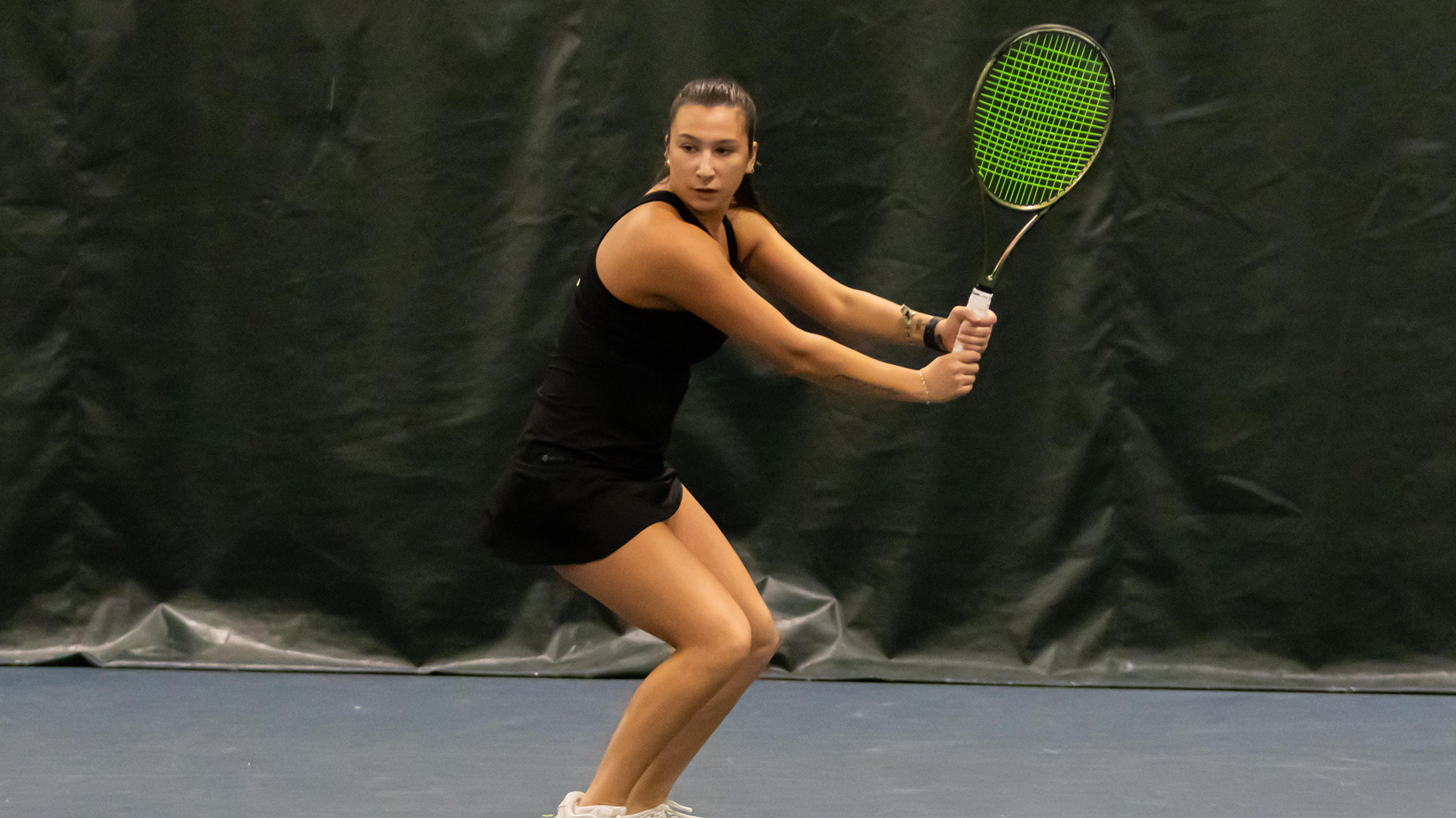 Gabriella Blumberg hitting a backhand