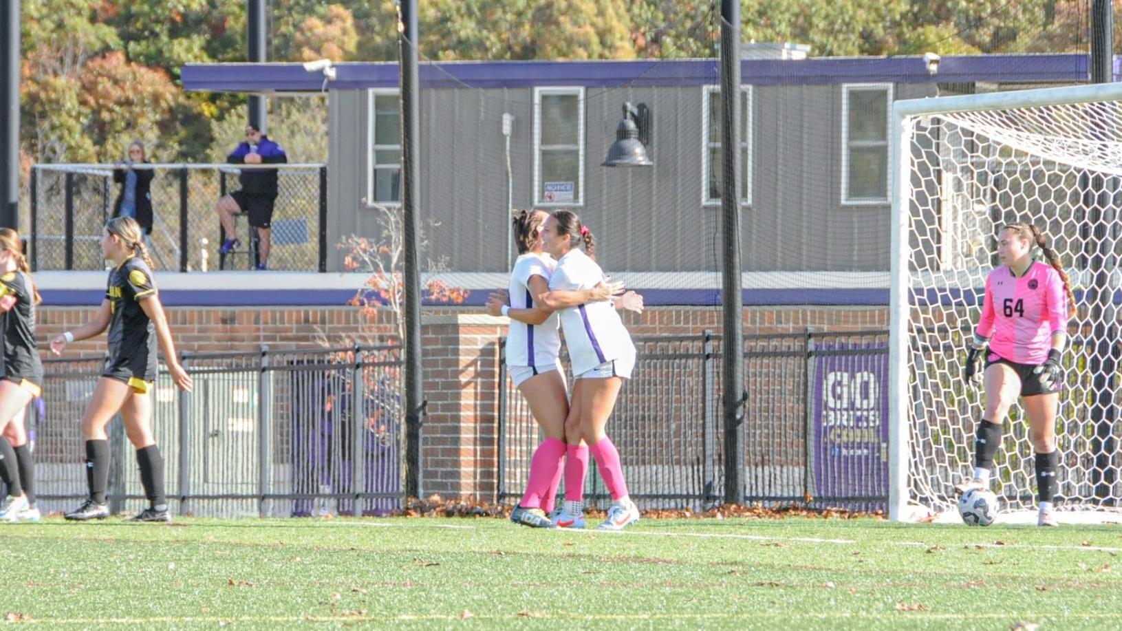 Ceci Irwin and Chloe Salo celebrate a goal