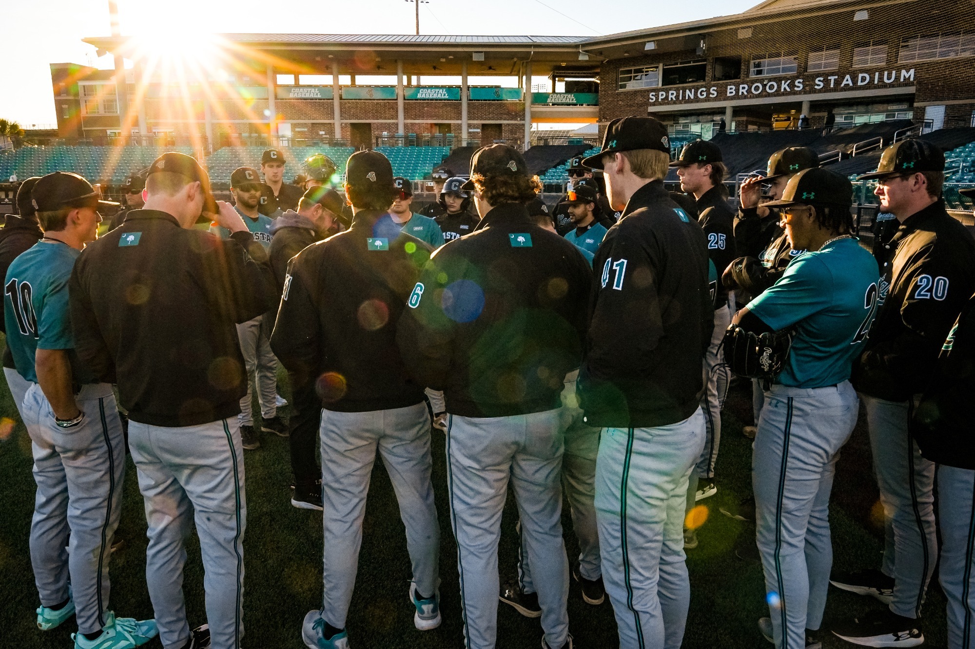 Baseball team huddles to talk before practice on Jan. 16, 2025 